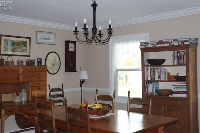 dining area featuring plenty of natural light, an inviting chandelier, and crown molding