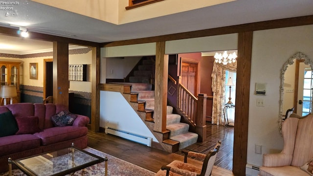 living room with dark wood-type flooring, baseboard heating, and crown molding