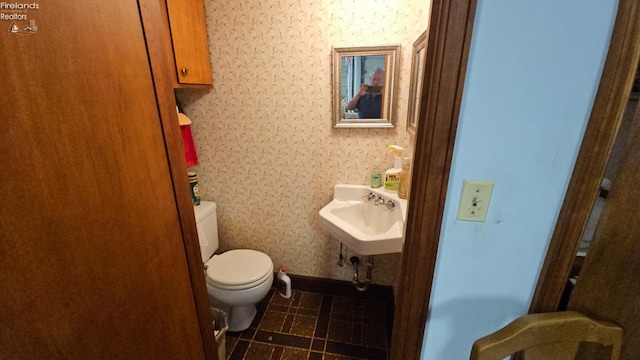 bathroom with toilet and sink