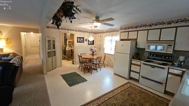 kitchen featuring white appliances and ceiling fan