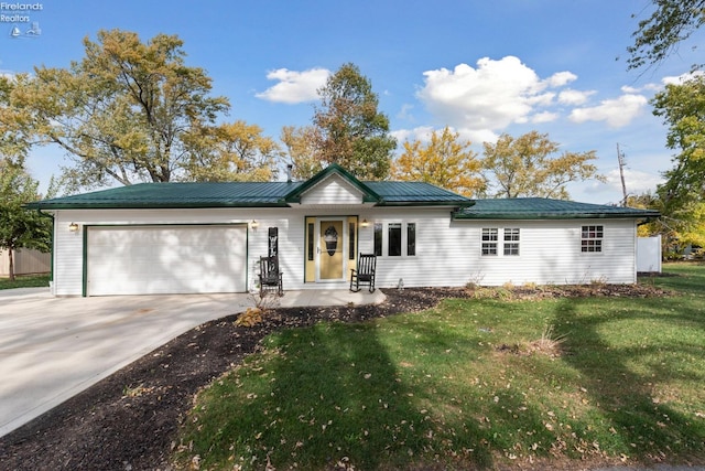 single story home with a front lawn and a garage