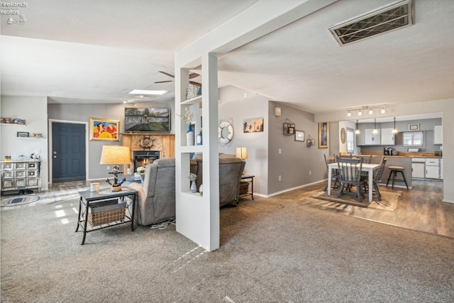 living room with hardwood / wood-style floors and a textured ceiling