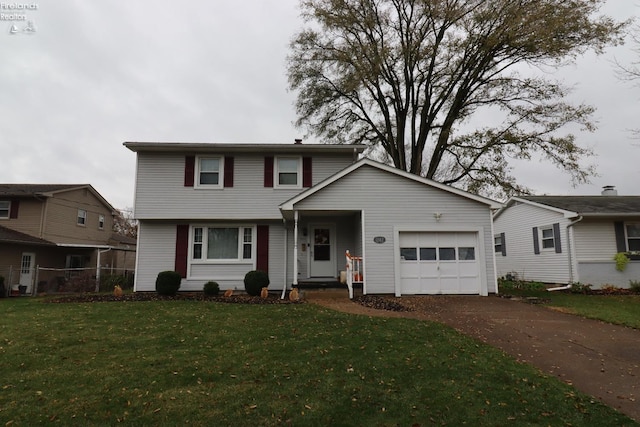 front facade with a garage and a front yard