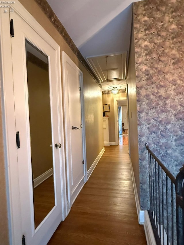 hallway with hardwood / wood-style floors