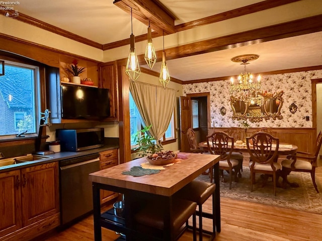 kitchen featuring light hardwood / wood-style flooring, an inviting chandelier, a healthy amount of sunlight, and appliances with stainless steel finishes