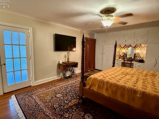 bedroom with ceiling fan, crown molding, and wood-type flooring