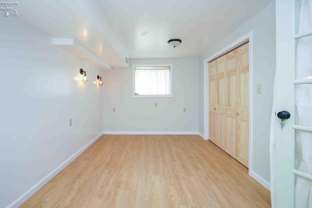 unfurnished room with light hardwood / wood-style floors