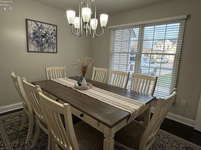 dining room with a notable chandelier