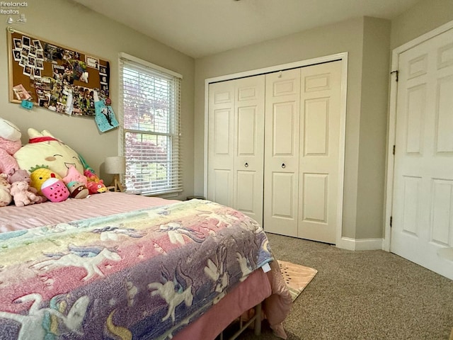 carpeted bedroom featuring a closet