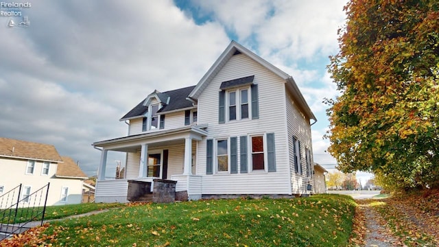 view of front of home featuring a porch and a front yard