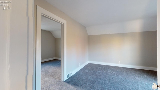 interior space with carpet and lofted ceiling