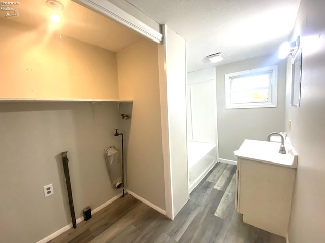 bathroom with vanity and wood-type flooring