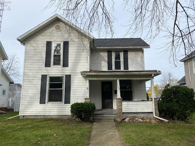view of front of house featuring a front yard and a porch