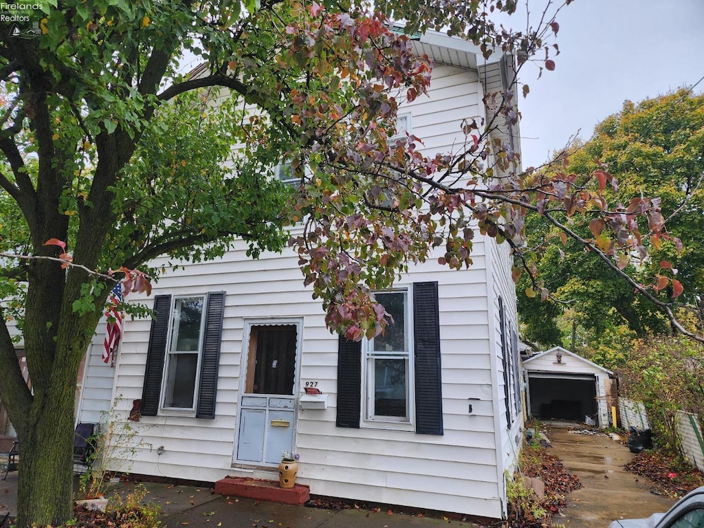 view of front of house with an outbuilding and a garage