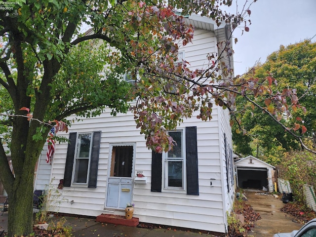 view of front of house with an outbuilding and a garage