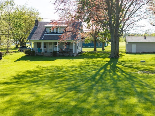 exterior space featuring covered porch and a lawn