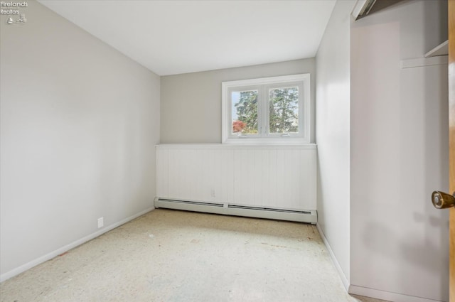 unfurnished bedroom featuring baseboard heating