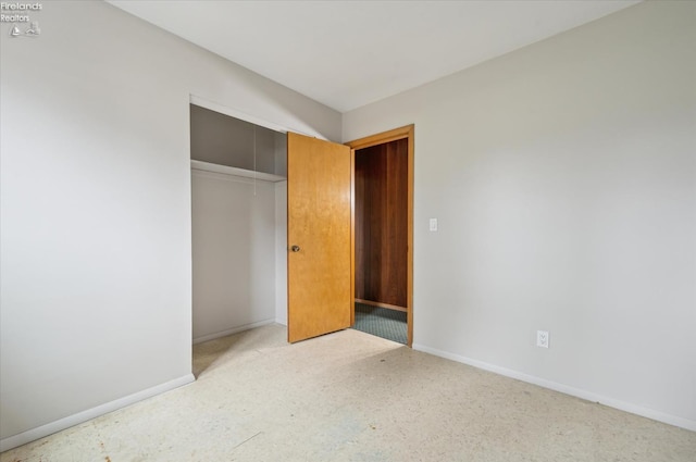 unfurnished bedroom with a closet