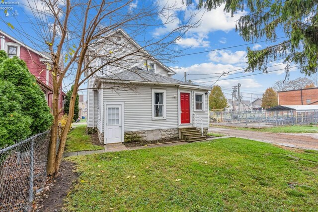 bungalow with a front lawn