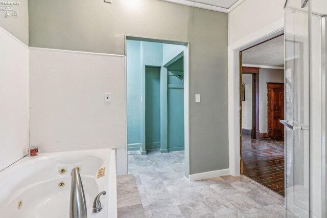 bathroom featuring hardwood / wood-style floors and independent shower and bath