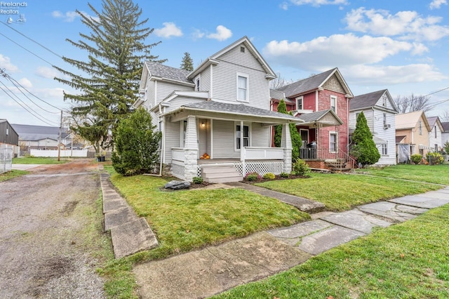 view of front of property with a front lawn and a porch