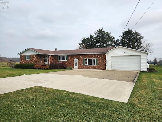 ranch-style home featuring a garage and a front lawn