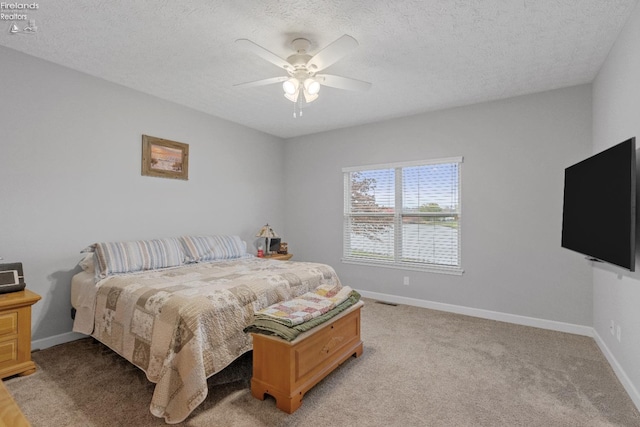 2133 S Harbor Bay Dr, Marblehead, OH 43440 - bedroom with baseboards, a textured ceiling, a ceiling fan, and light carpet