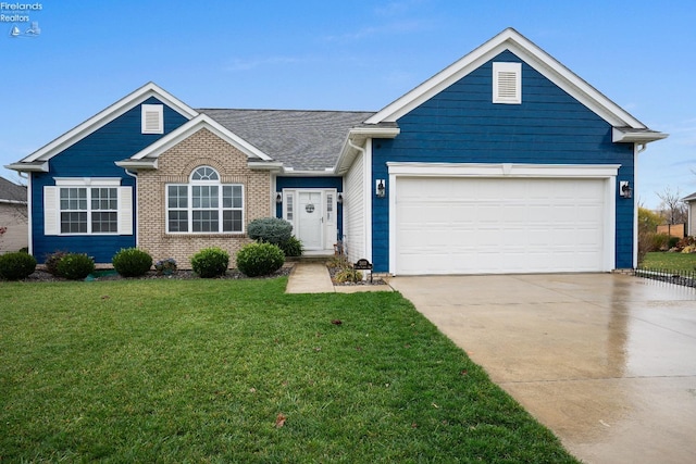 view of front of house featuring a garage and a front lawn