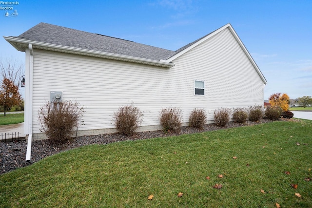 2133 S Harbor Bay Dr, Marblehead, OH 43440 - view of property exterior featuring a yard and roof with shingles