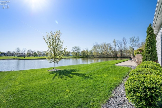 2133 S Harbor Bay Dr, Marblehead, OH 43440 - view of green lawn featuring a water view and a patio