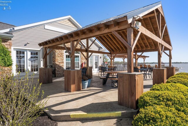2133 S Harbor Bay Dr, Marblehead, OH 43440 - view of community featuring a water view, a patio area, a gazebo, and outdoor dining space