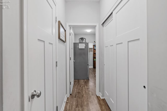 corridor featuring dark hardwood / wood-style floors