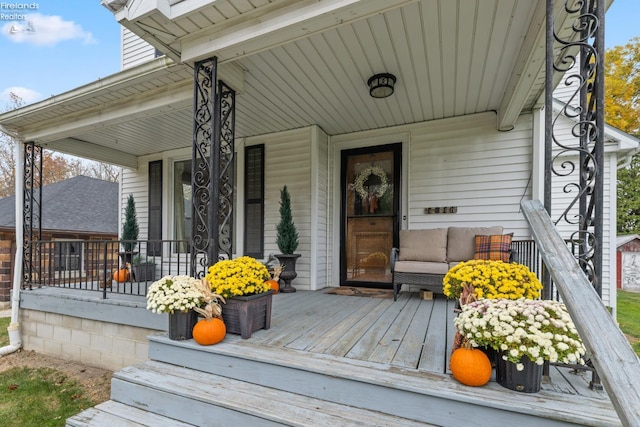 wooden terrace with a porch