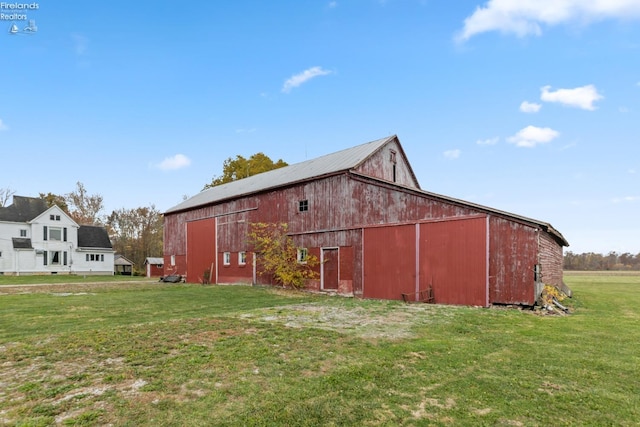 view of outbuilding featuring a yard