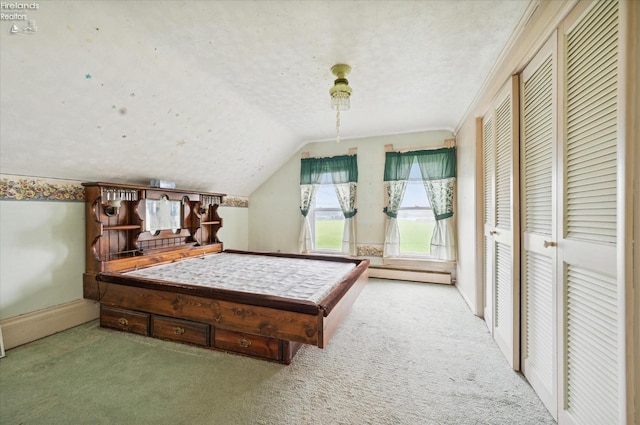 bedroom with a closet, carpet floors, lofted ceiling, and pool table