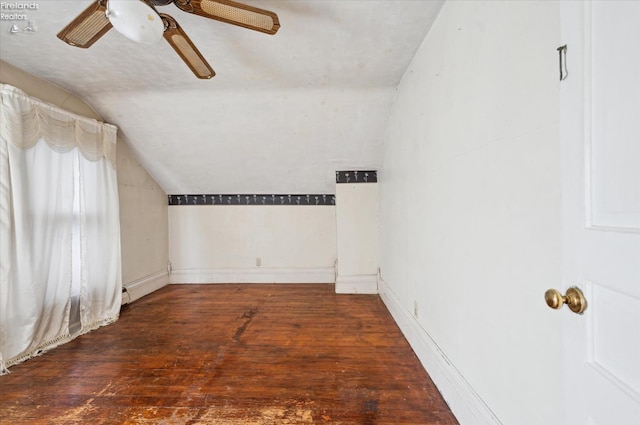 bonus room with ceiling fan, dark hardwood / wood-style flooring, and vaulted ceiling