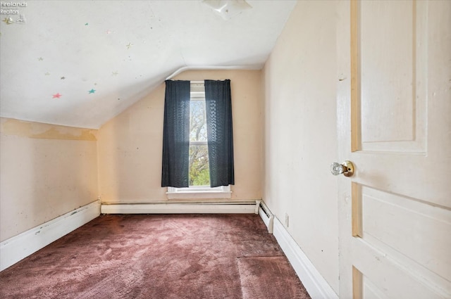 bonus room featuring dark carpet, vaulted ceiling, and a baseboard heating unit