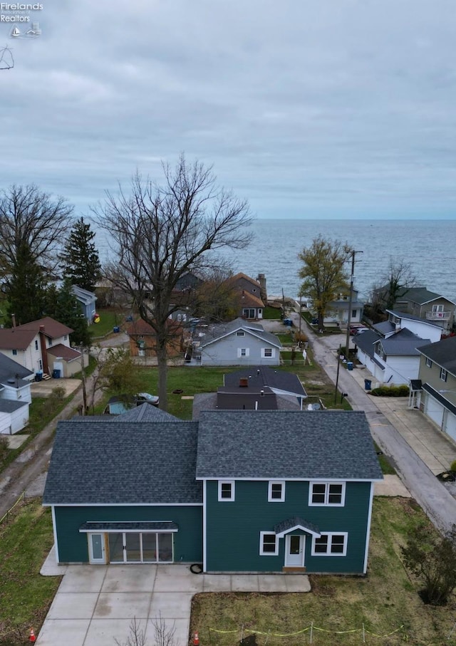 drone / aerial view with a water view