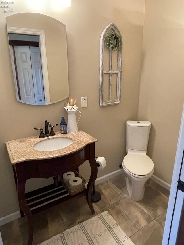 bathroom with toilet and sink