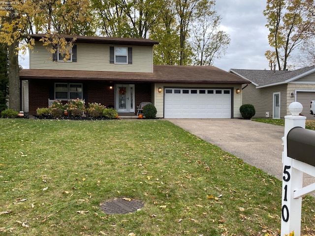 view of property with a garage and a front lawn