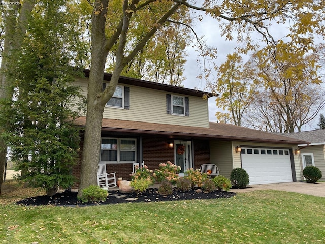 view of front of home featuring a front yard and a garage