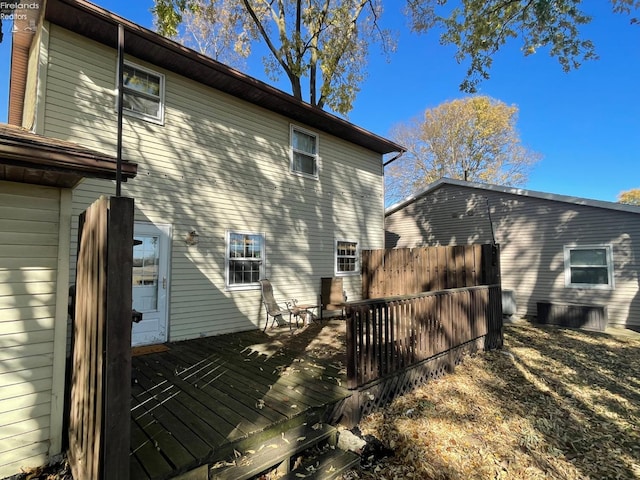 rear view of property with a wooden deck