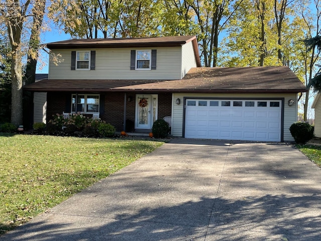 front of property with a garage and a front lawn