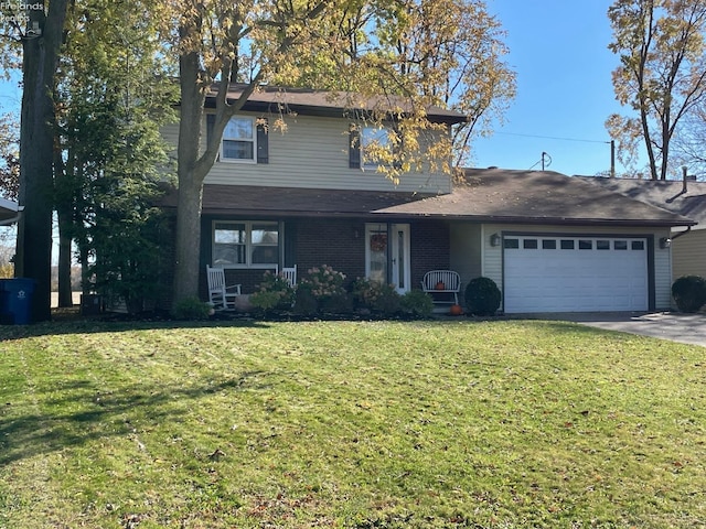 view of property with a front yard, a porch, and a garage