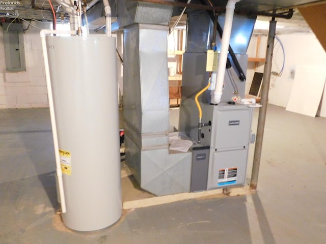 utility room featuring electric panel and water heater