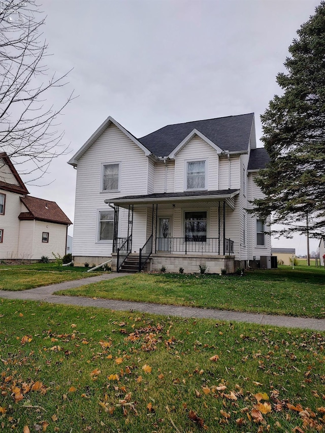 view of front of house with a porch and a front lawn