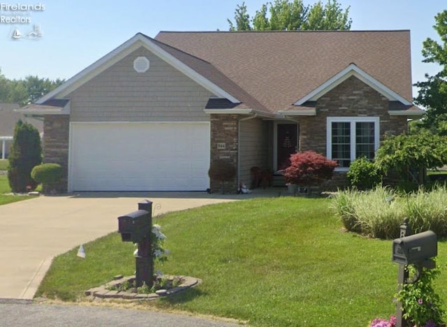 view of front facade featuring a front lawn and a garage