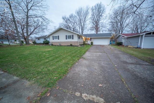 single story home featuring a front yard and a garage