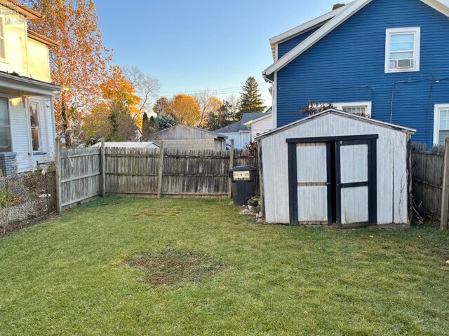 view of yard with a storage unit