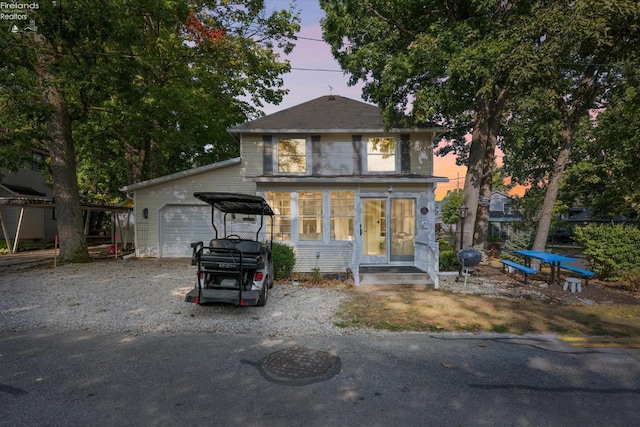 view of front of property with a garage